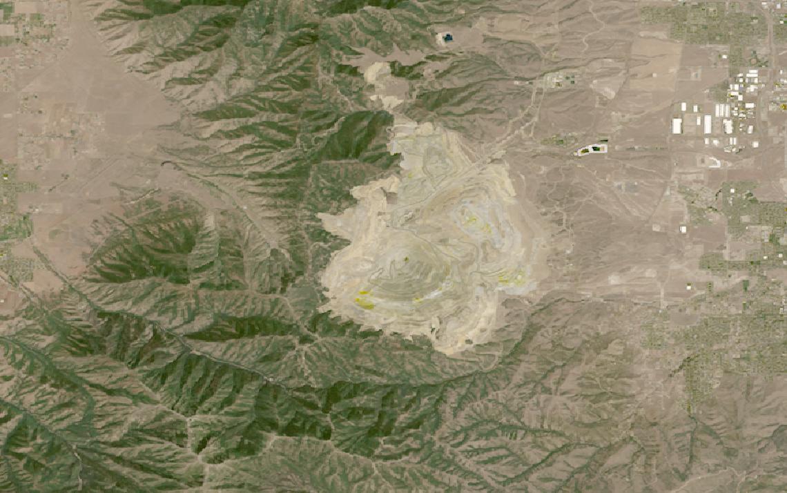 Landsat satellite image of the Bingham Canyon open-pit copper mine and its terraced waste rock benches in Utah